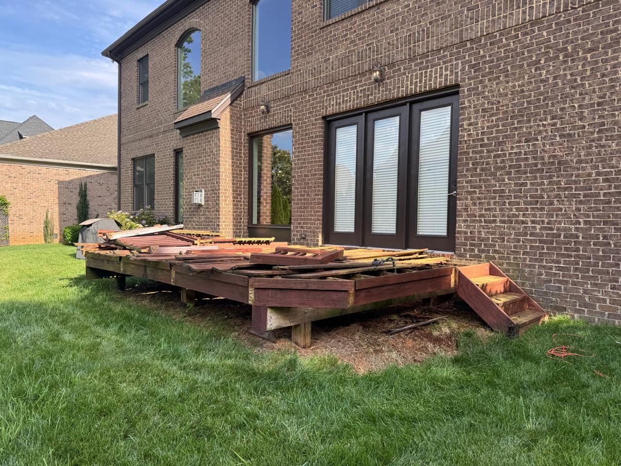 An old deck stripped back to its frame during a rebuild